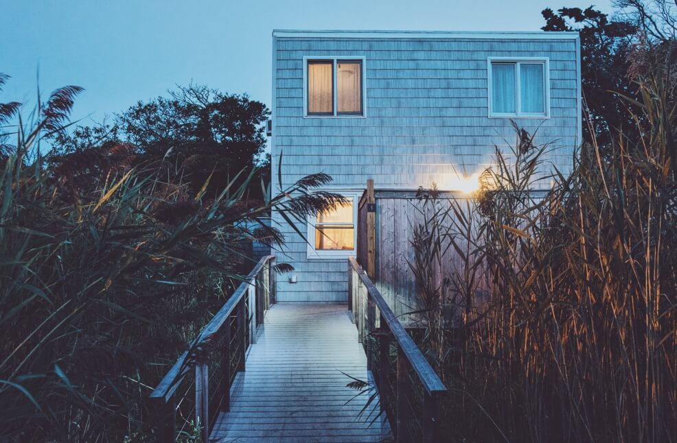 side view of blue wooden beach house